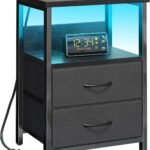 Fixwal black LED nightstand with charging station, three fabric drawers, open shelves, USB ports, AC outlets, and modern bedside storage.