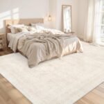 Luxurious beige washable 8x10 area rug in living room