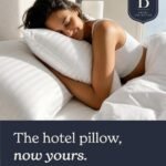 Beckham Hotel Collection bed pillows set of 2 being unboxed on a neutral bedroom carpet