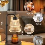 Modern candle warmer lamp warming a scented jar candle on a bedside table in a cozy bedroom.